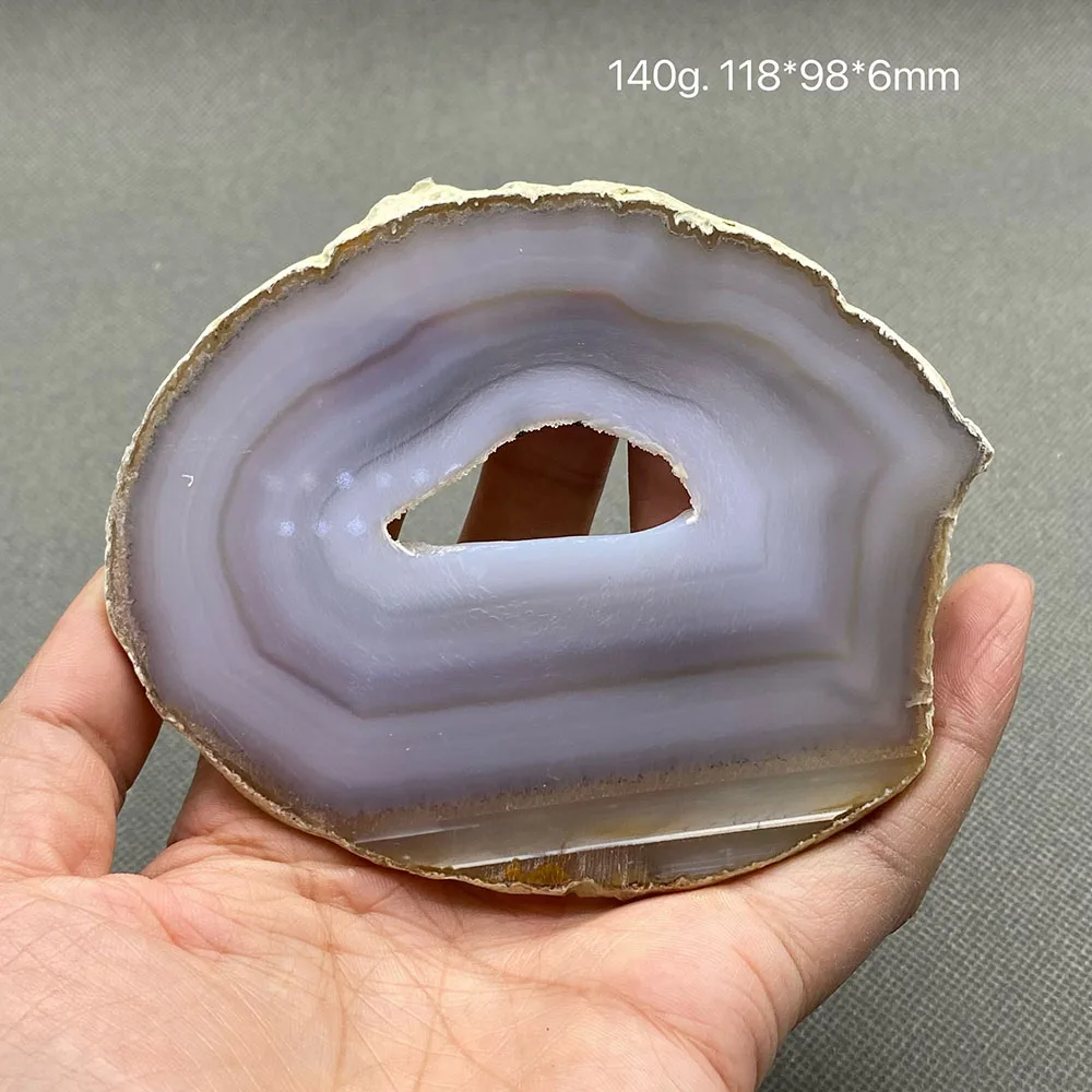 Natural agate slice polished ore specimen with crystal hole