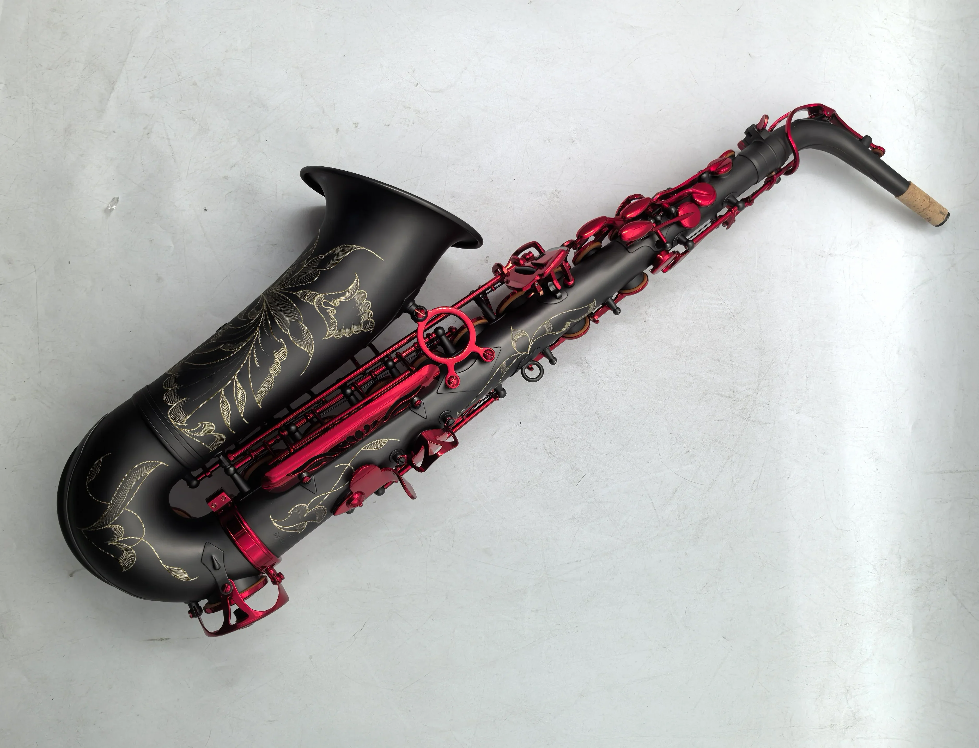 The Imperium matte black nickel plated Alto Saxophone with red lacquer keys
