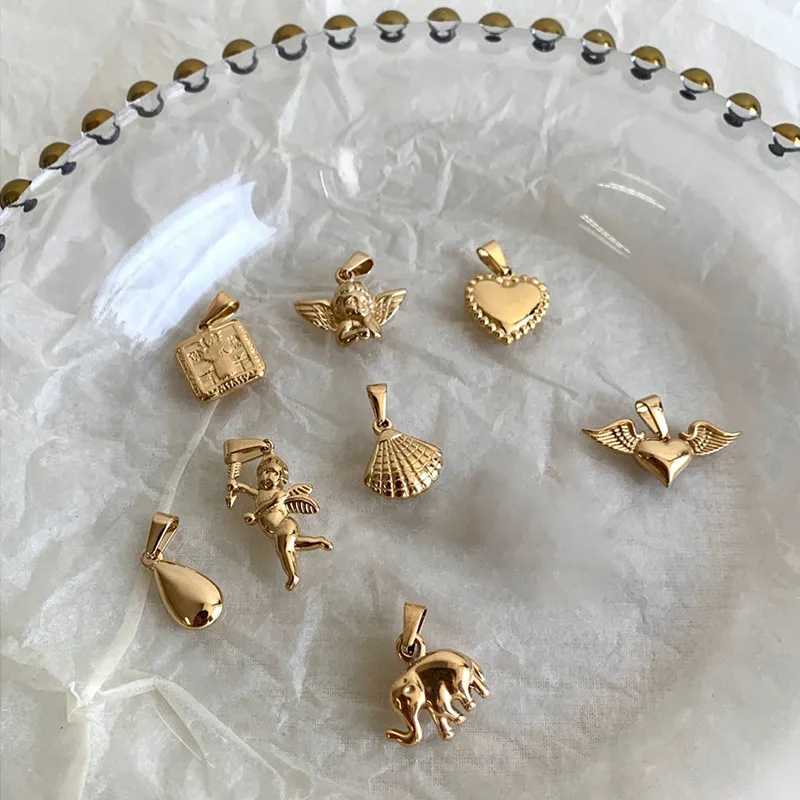 Orecchini pendenti con cuore bombato bombato in acciaio inox oro 18k