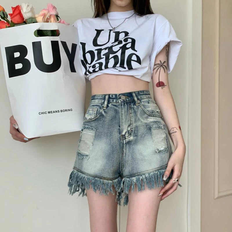 

Broken hole denim shorts female ins thin section niche retro high waist loose wide leg do old fringe a word hot pants summer