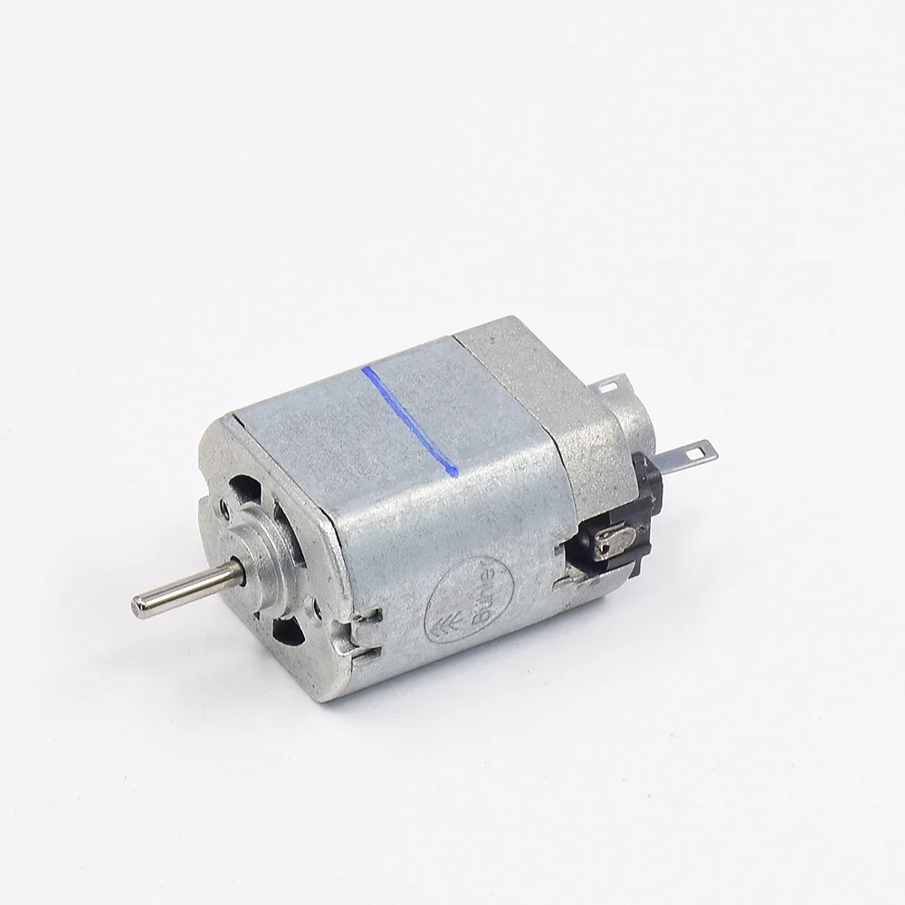 Moteur Buhler Micro 18x23.5mm DC 12V-24V Haute Vitesse comparé à une pièce de monnaie pour l'échelle.