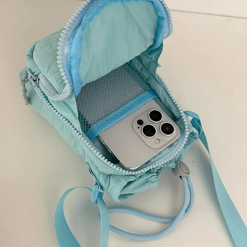 Lightweight Nylon Sling Bag with Adjustable Strap and Zipper Pocket