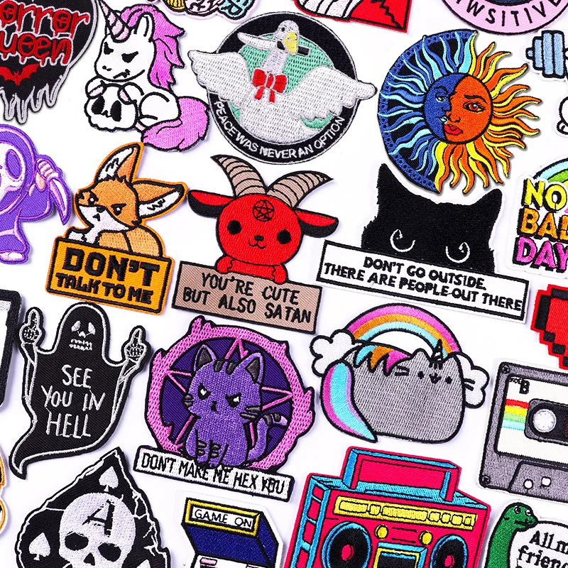 Collection of various colorful patches with different designs and text.