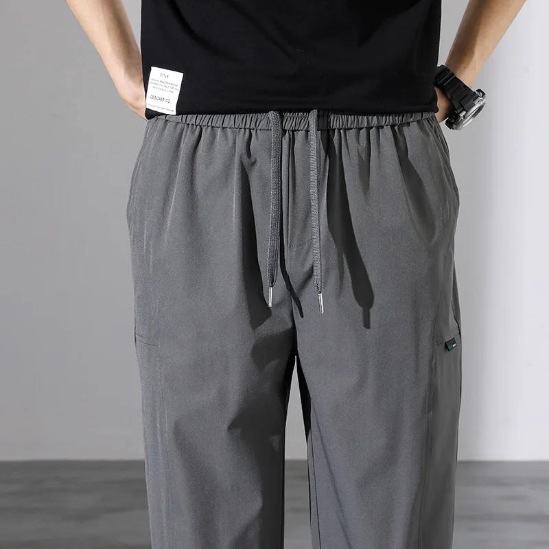 Spring and Autumn Men's Elastic High Waist Solid Pocket Drawstring Harlan Casual Sports Shrink Trousers Office Lady Pants