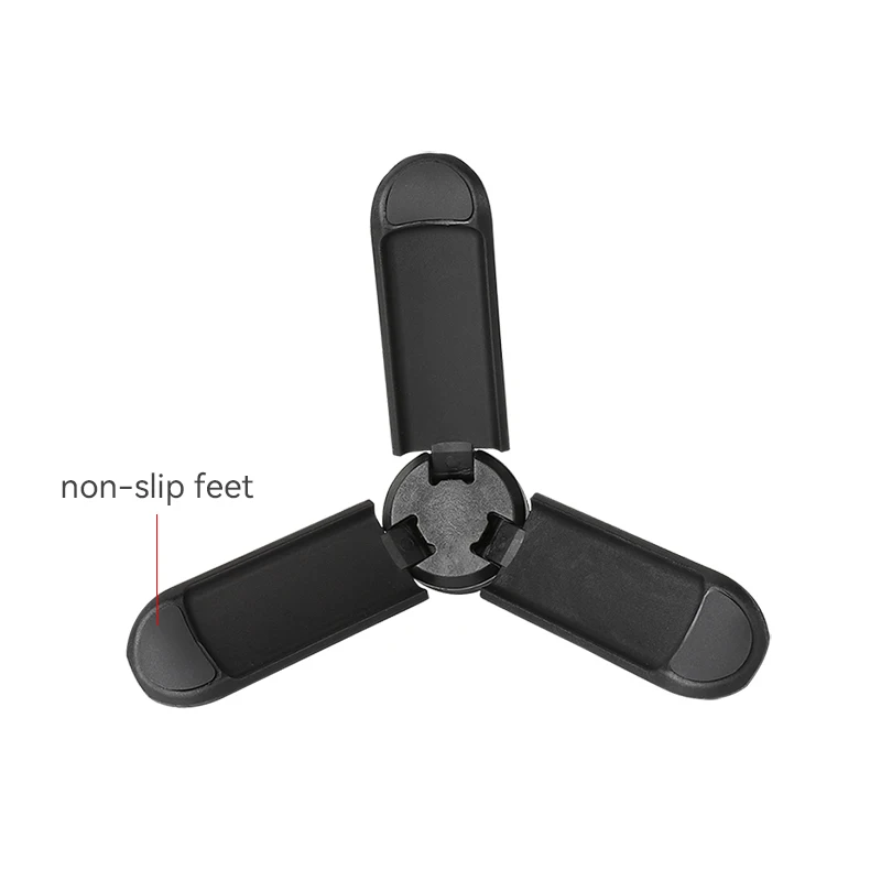 Mini trépied universel pour caméras action et stabilisateurs utilisé avec une Insta360, posé sur une table.