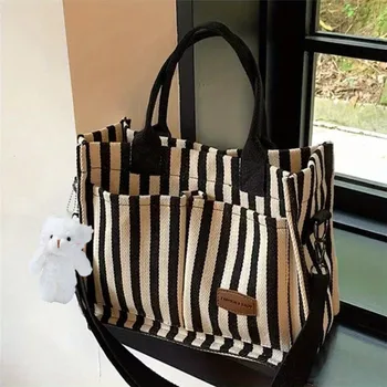 حقيبة حمل قماشية مخططة عصرية: مثالية للتنقل أو السفر - وصول جديد في حقائب اليد النسائية 2