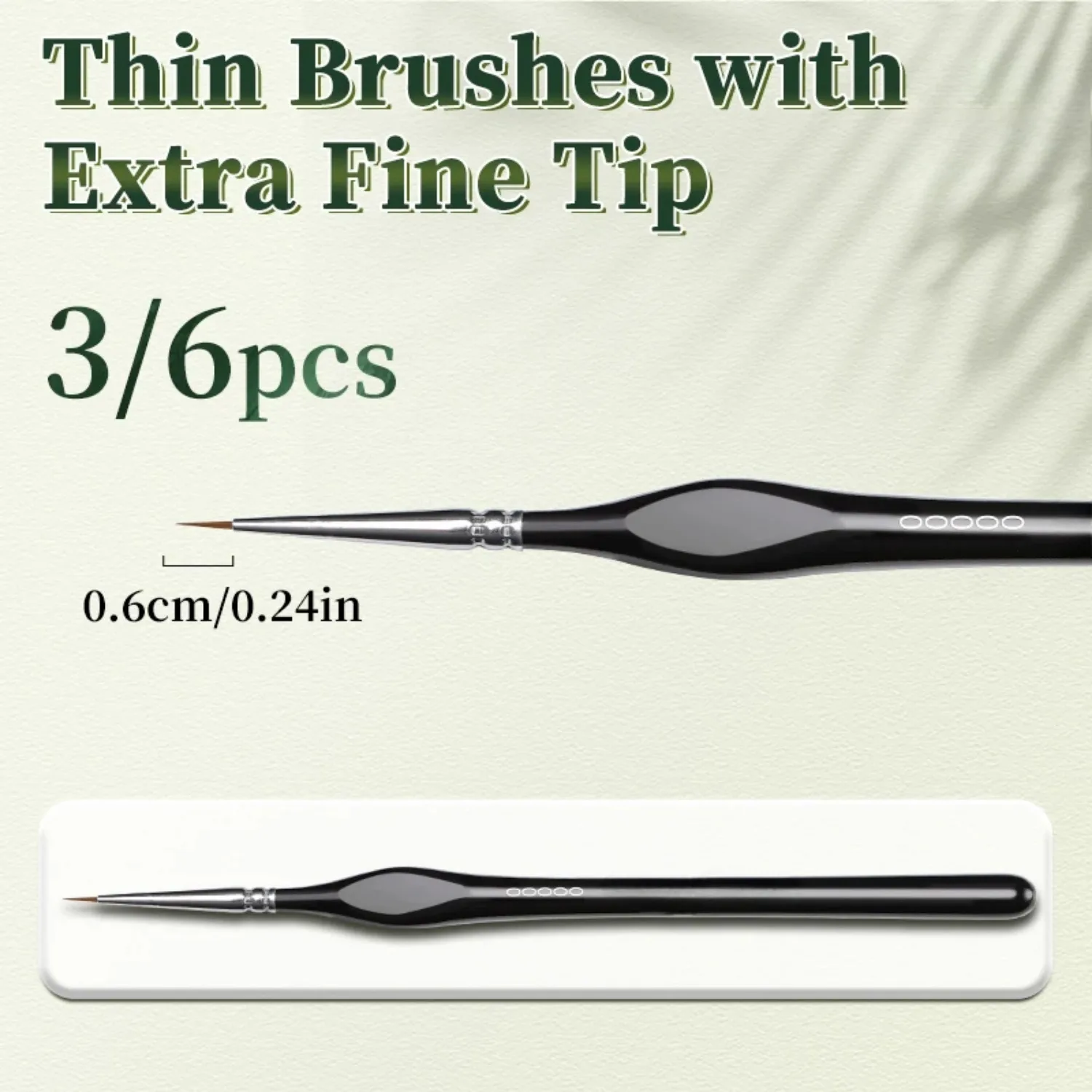 Zestaw pędzli prezentowany w dłoni