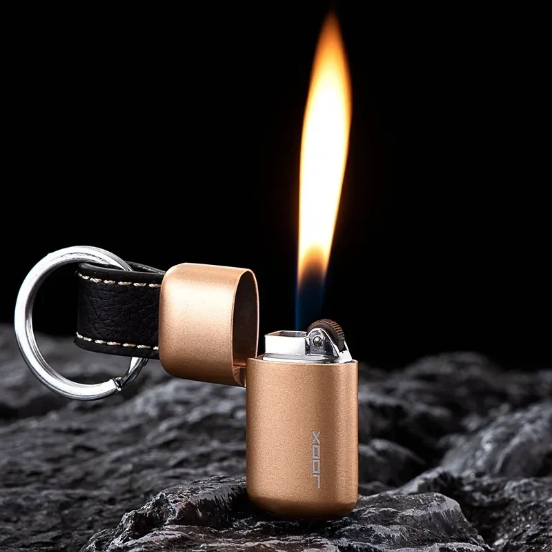 

Palm Bao grinding wheel inflatable open flame lighter creative personality portable mini key chain lighter Tik Tok supply.