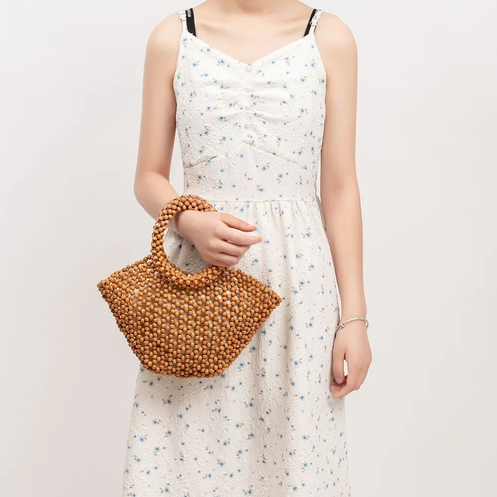 Women's Woven bag new hollow out bucket bag summer design commuter wood bead totes bag bohemian travel beach handbag Clutch bags