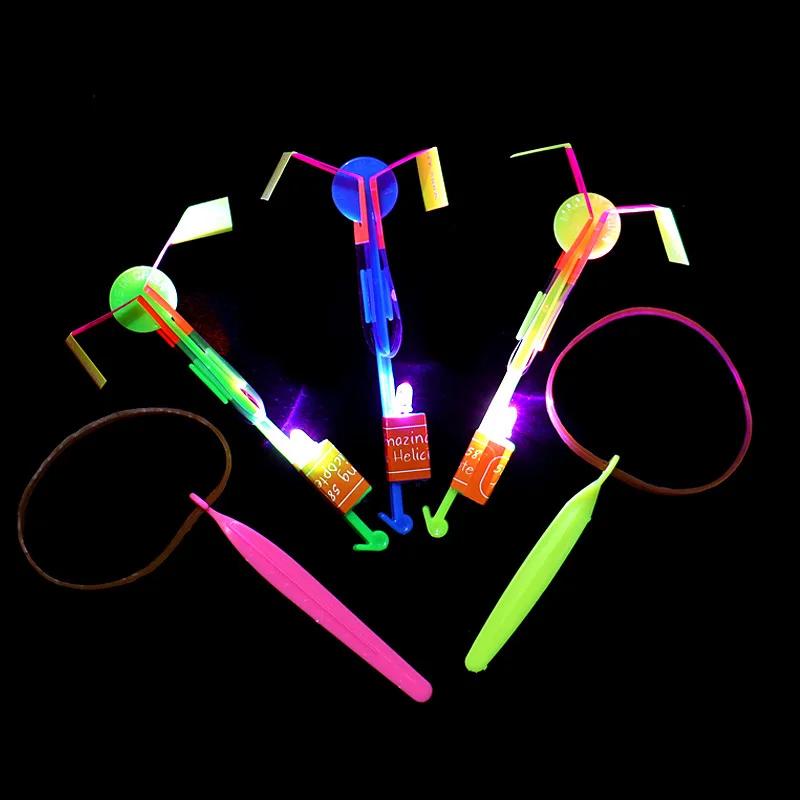 Flying Toy 1/3/5/10/20/50/100pcs Light Toy Arrow Rocket Helicopter Flying Toy LED Light Toys Party Fun Gift Rubber Band Catapult