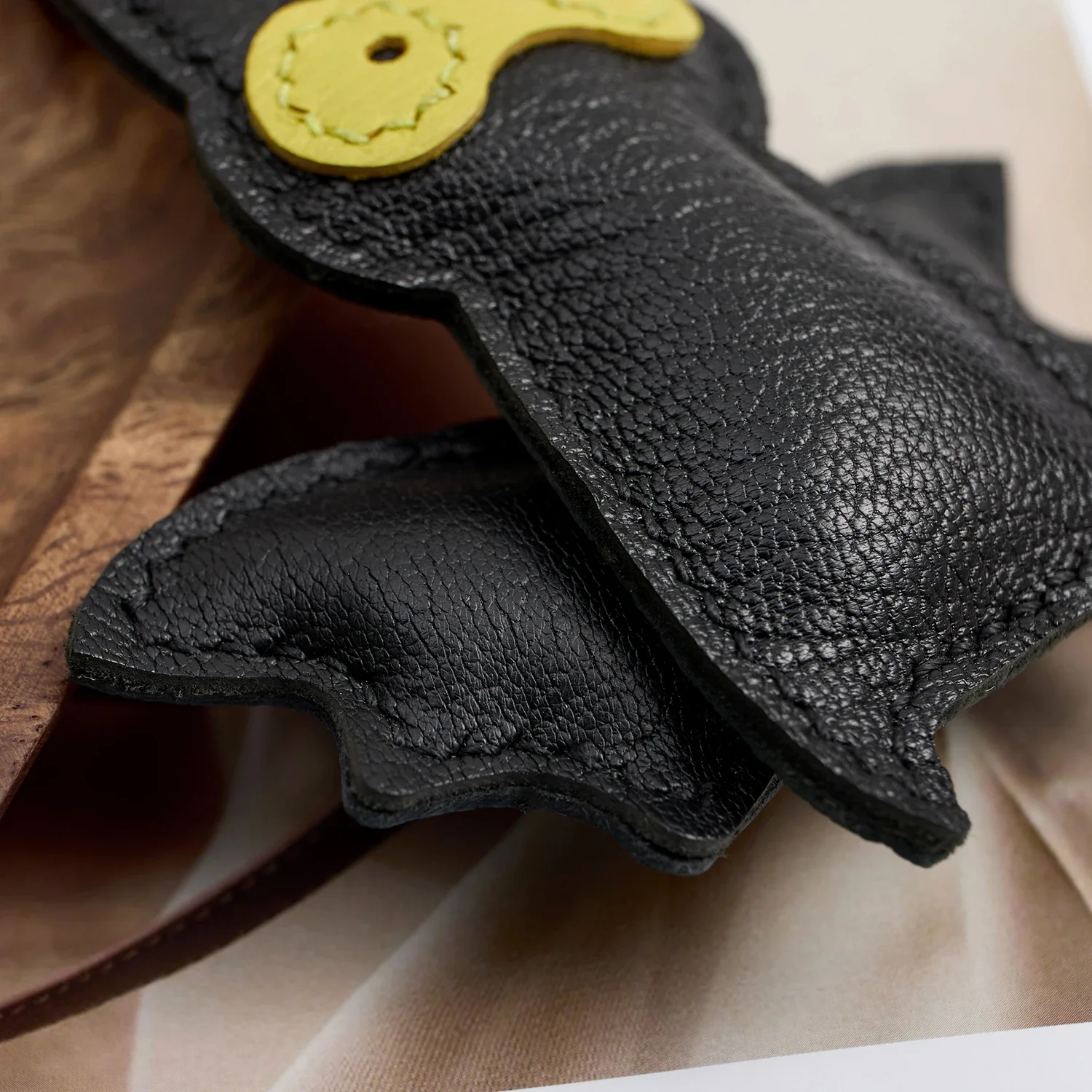 Handcrafted bat leather charm texture
