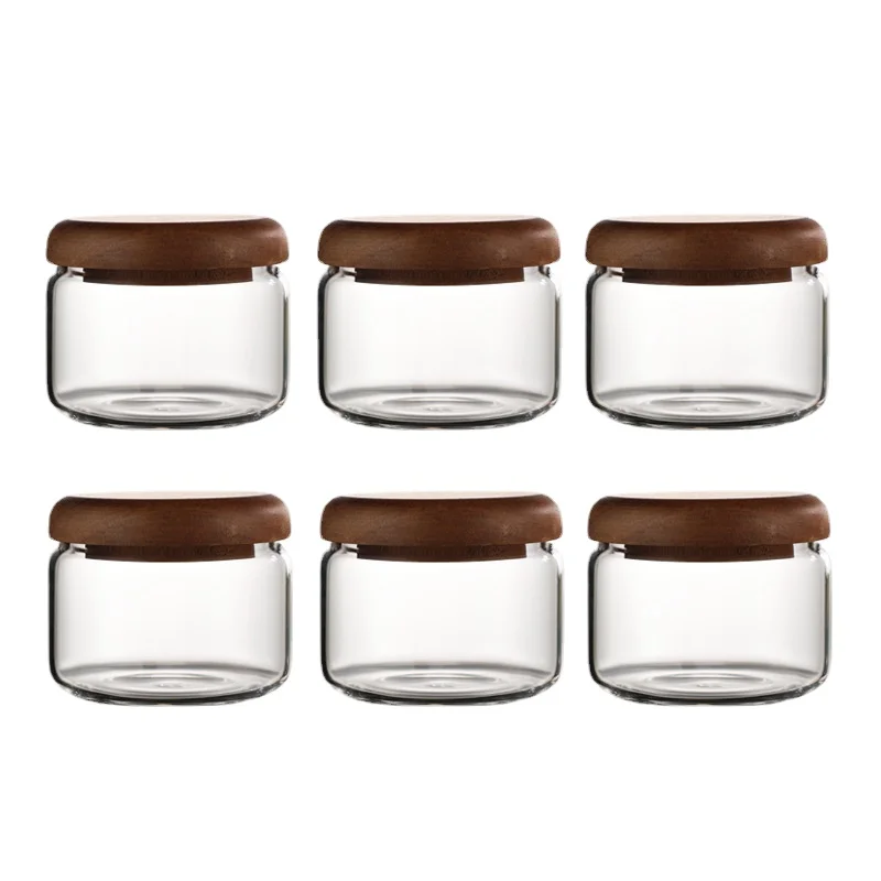 https://ae01.alicdn.com/kf/Se57048813dbe4fa985e9ed8c0b743fe7A/Creative-Mini-Clear-Glass-Jar-Coffee-Tea-Cans-Food-Storage-Container-Wooden-Lid-Glass-Candy-Jar.jpg