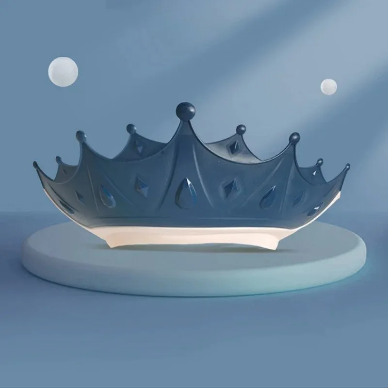 Shampoo hat demonstrating how it shields eyes and ears from water during hair washing