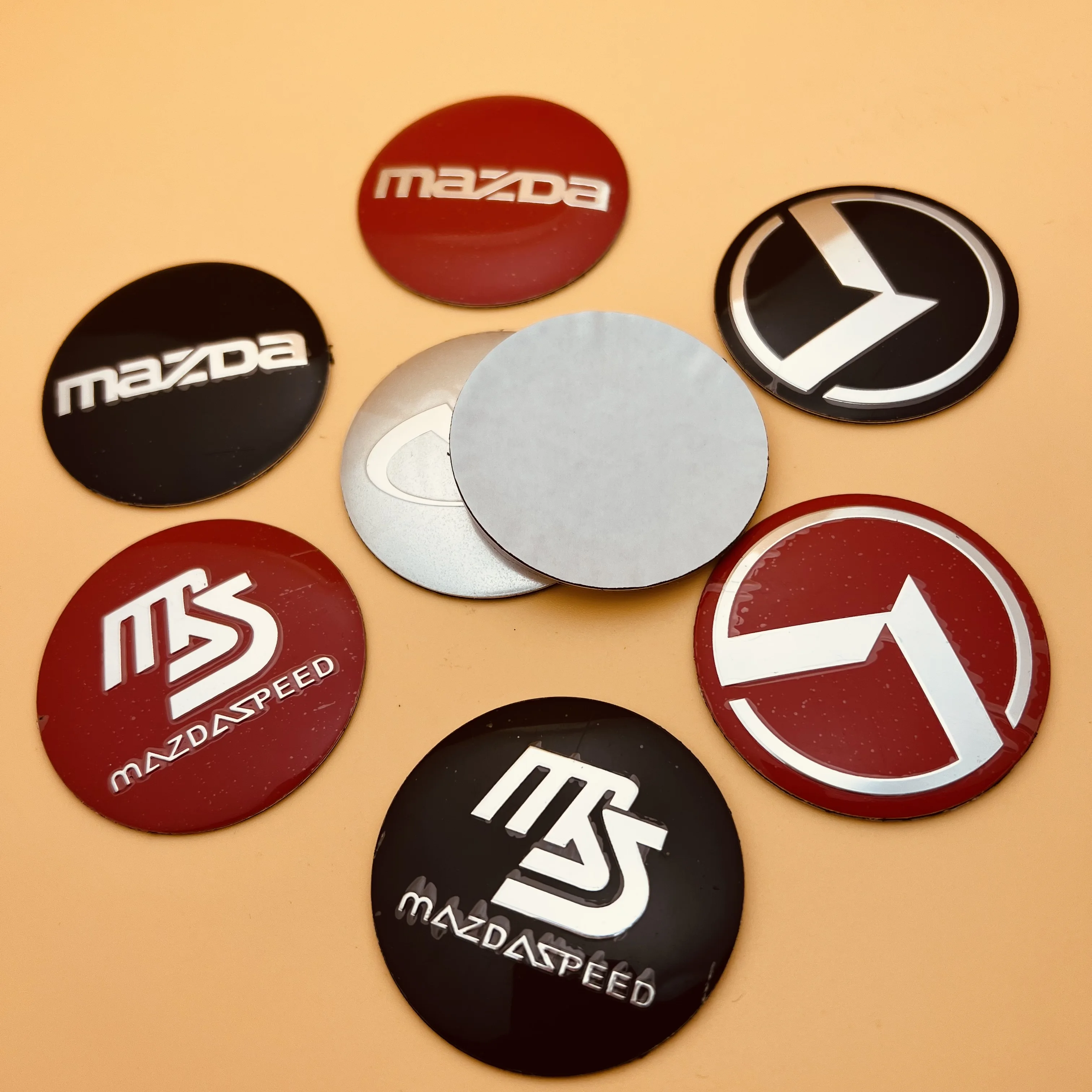 

4pcs 3D aluminum 56mm car hub center cover badge stickers suitable for various new and modified Kia Mazda Infiniti car stickers