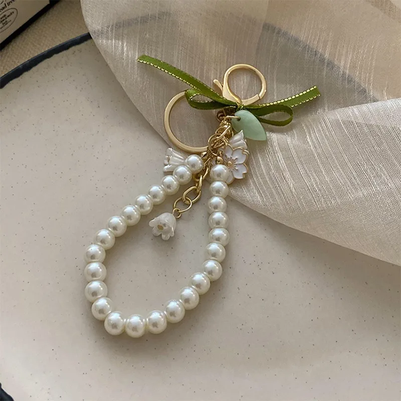 Fresh and Elegant Bell Orchid Keychain: Green Imitation Pearl and Leather Resin Alloy Accessory