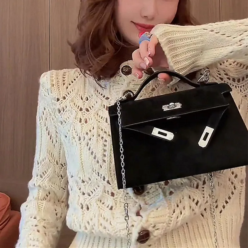 

New hollow cardigan knitted sweater coat female design sense temperament retro coat outside.