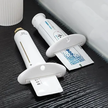Spremi dentifricio in plasticaDispenser manuale per dentifricio, spremiagrumi multifunzionale indipendente per accessori da bagno 1