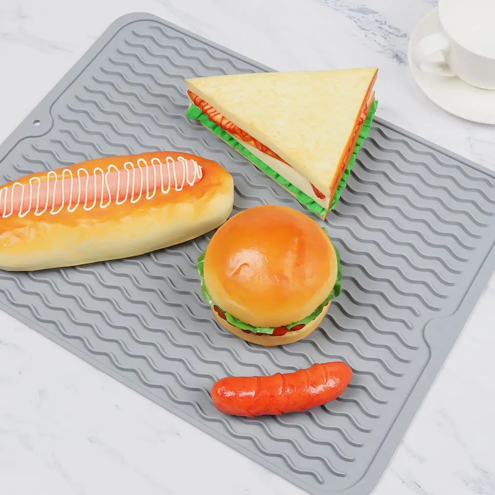 https://ae01.alicdn.com/kf/Se64b3f5ac18a43899ed36cbefbe300252/40x30CM-Foldable-Soft-Silicone-Dishes-Mat-Anti-Slip-Drying-Heat-Insulation-Kitchen-Drain-Mat.jpg