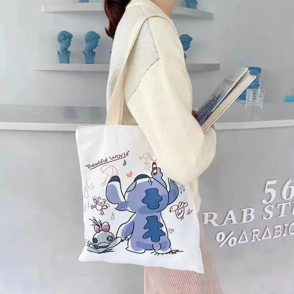 thumbnail image 1 of Bolsa de lona Stitch Disney para mujer, con dibujos animados de anime Stich, reutilizable, para la escuela, con cremallera interior, regalo para niña, 1 of 5