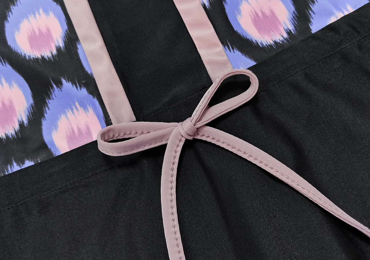 Stylish modest swimsuit for Muslim women with purple floral prints and high-stretch comfort.