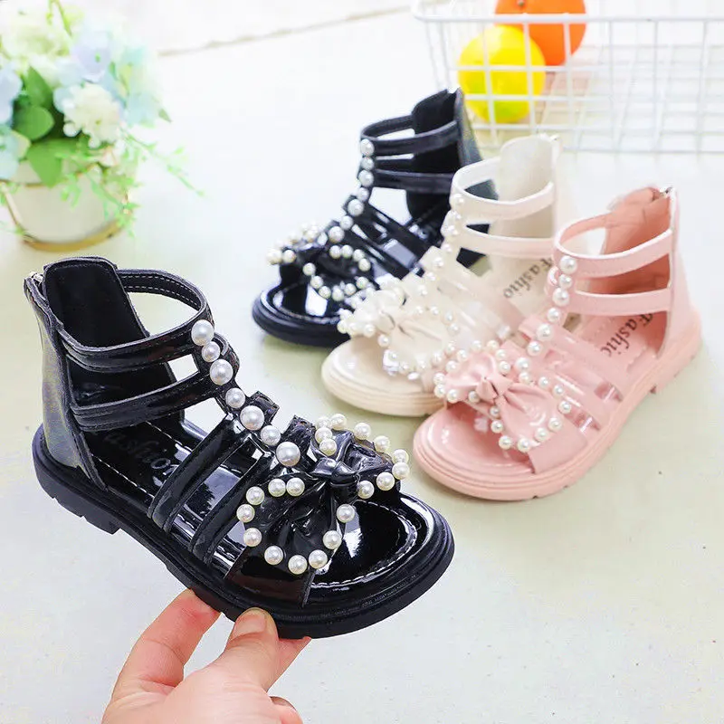 

Free Shipping Girls Summer Gladiator Beaded Sandals Princess Pearl Bow Shoes Soft Sole Childrens Flat Low Heel Hollow Kid Sandal