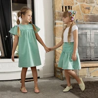 Collection Ali Co SS26 Green Denim : vêtements en coton pour garçons et filles, robes, jupes, chemises et salopettes - RE-EN STOCK LE DÉBUT DU MAI 2