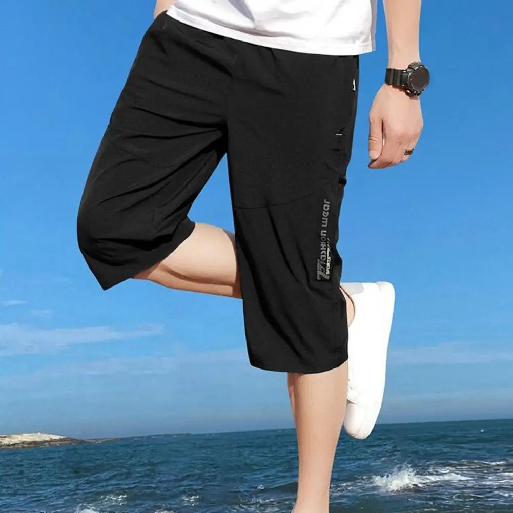Description Picture 3 of itemSolid Color Cropped Pants Men's Elastic Waist Cropped Pants with Zipper Pockets Soft Breathable Mid-calf for Comfort for Casual