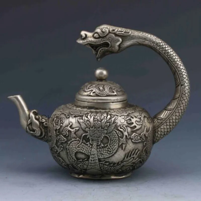 

Rare Old Collection Chinese Tibetan silver hand-carved dragon teapot