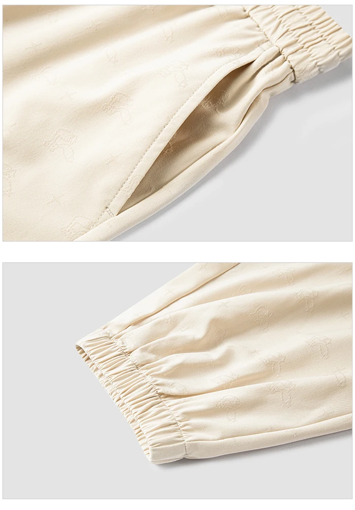 Pantalones casuales para mujer diseñados con un toque de textura. Pantalones cónicos de jacquard con estampado oscuro y un ajuste único y holgado.