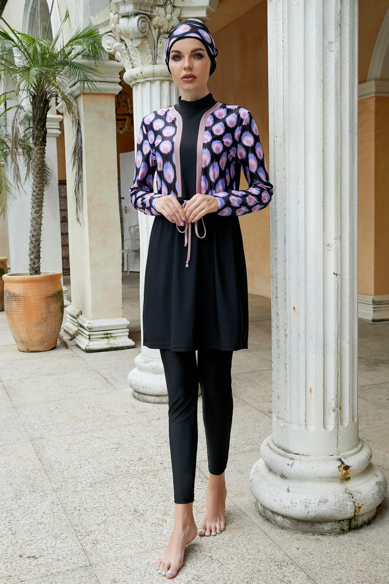 Close-up of purple circular chest pattern on modest swimwear top