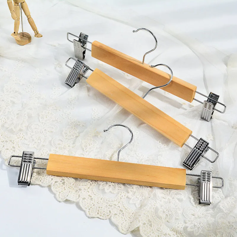 https://ae01.alicdn.com/kf/Se77da4b3bf114a9abd5900c1fbe6e139A/Solid-Wood-Hangers-Non-Slip-Non-Trace-Clothes-Holder-With-Clips-Household-Wardrobe-Hanging-Clothes-Wooden.jpg