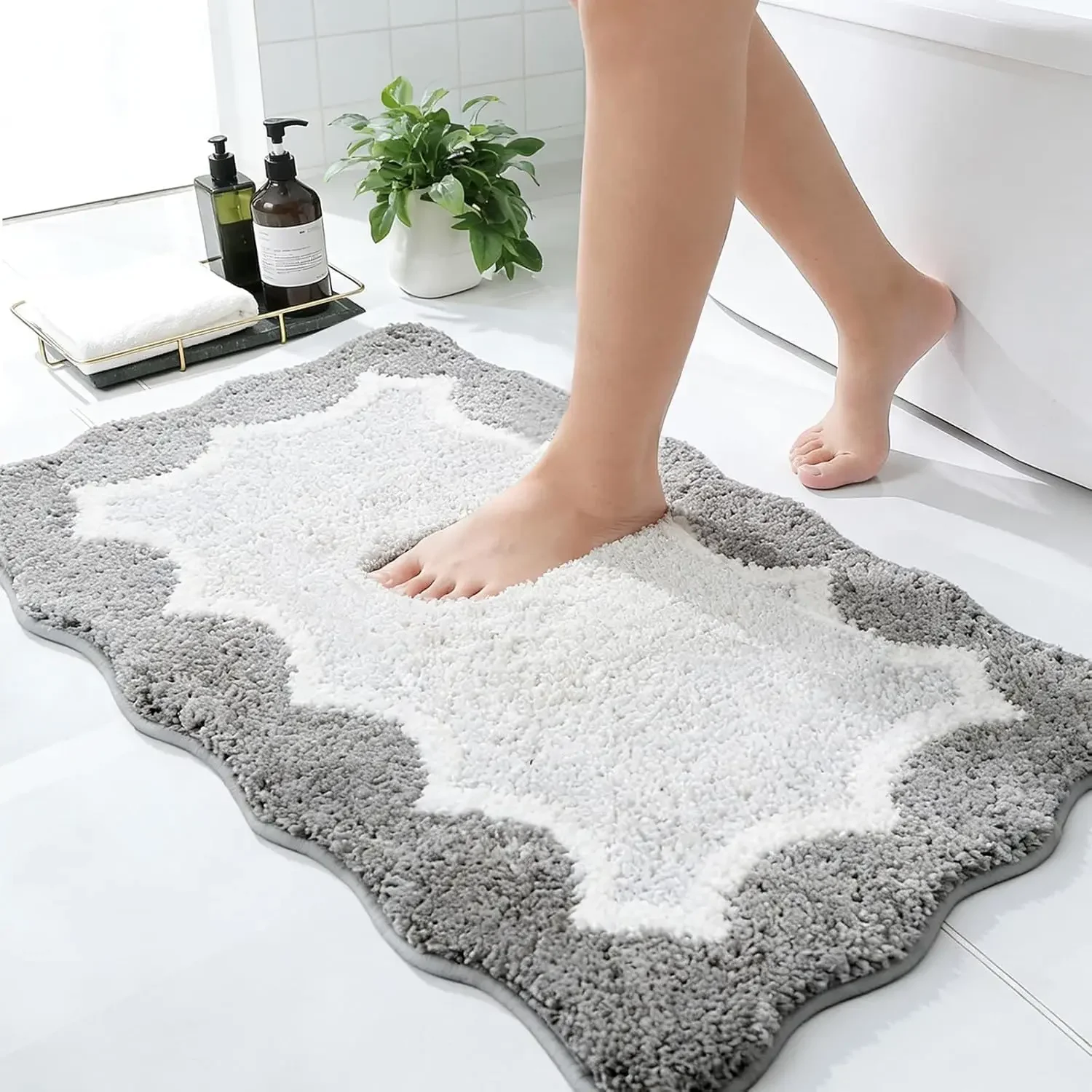 Cartoon bath mat with cute animal faces, ultra-absorbent, non-slip backing, and quick-dry fabric.