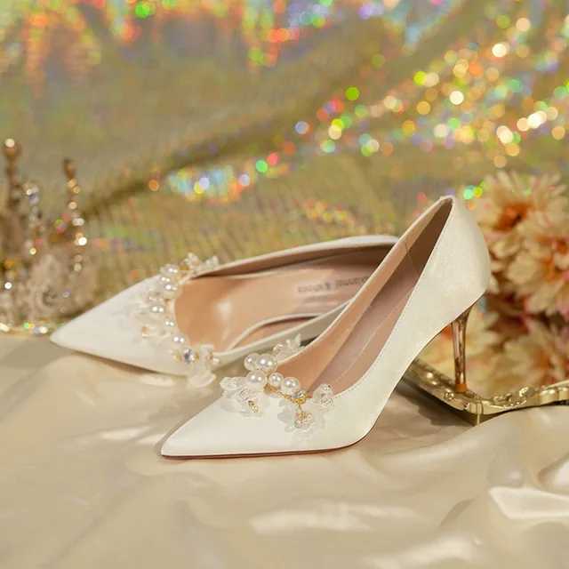 Experience luxury and comfort with the Womens Not Tired Feet 2023 New High Grade Pearl Fine Heel Chinese Bridal Shoes.