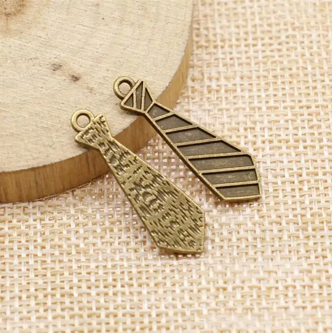 

16pcs 30x9mm tibetan Bronze textured tie design charms EF3587