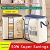 Creative thickened non-woven vertical version of the double ear handheld quilt clothing organization multi-purpose storage bag 1