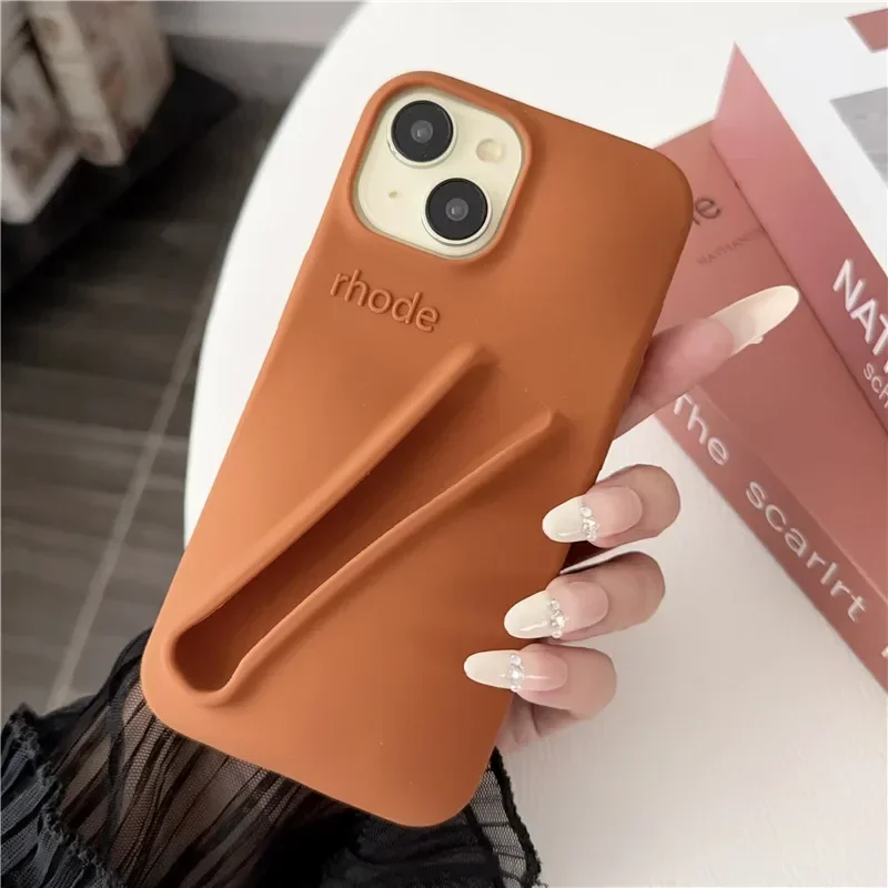 thumbnail image 1 of Estuche para teléfono de silicona suave con diseño de lápiz labial para iPhone 11, 12, 13, 14, 15 Pro Max, soporte portátil para brillo de labios Rhode Hailey, 1 of 5