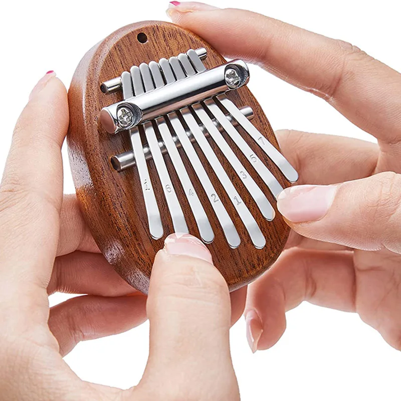 

1Pcs 8 Tone Mini Kalimba Toys Thumb Piano Music Instruments Solid Wood Water Drop Heart Cute Portable Children Instrument Toys