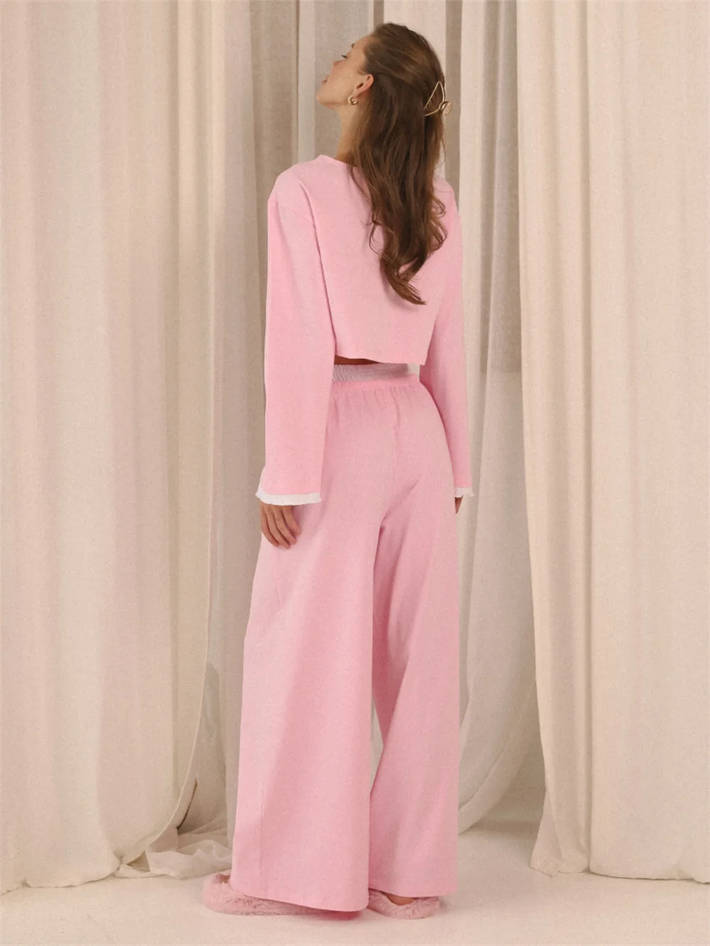 Close-up of soft fabric texture with button detail and comfortable pajama finish