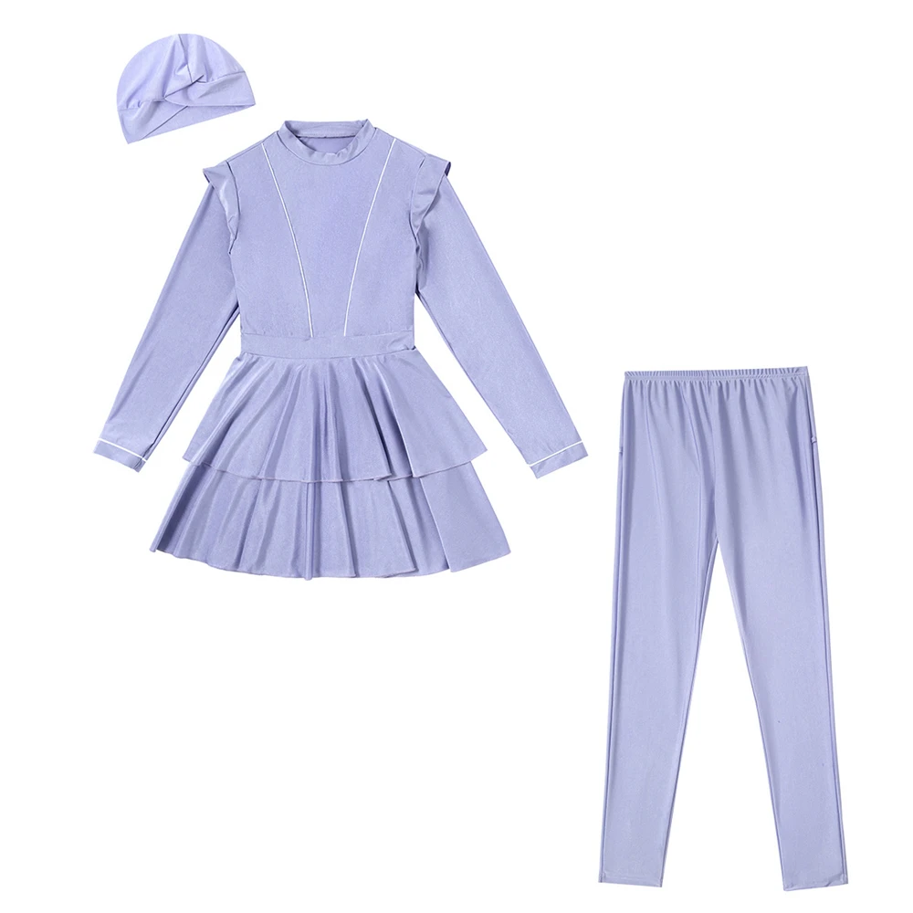 Neatly folded modest fashionable swimwear pieces laid out with fabric texture visible