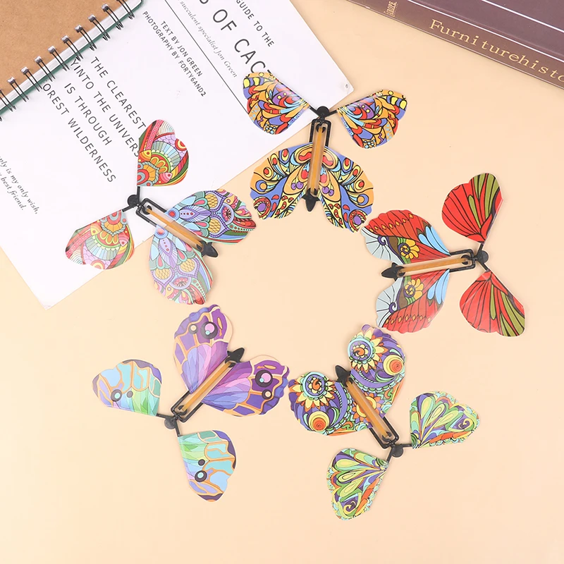 

10PCS Rubber Band Powered Magic Wind Up Flying Butterfly Surprise Box Magic Fairy Flying Toy Gift in The Book