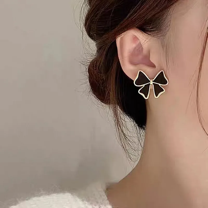 

New bow temperament senior feeling studs female simple new earrings unique design sense all matching ear accessories lady