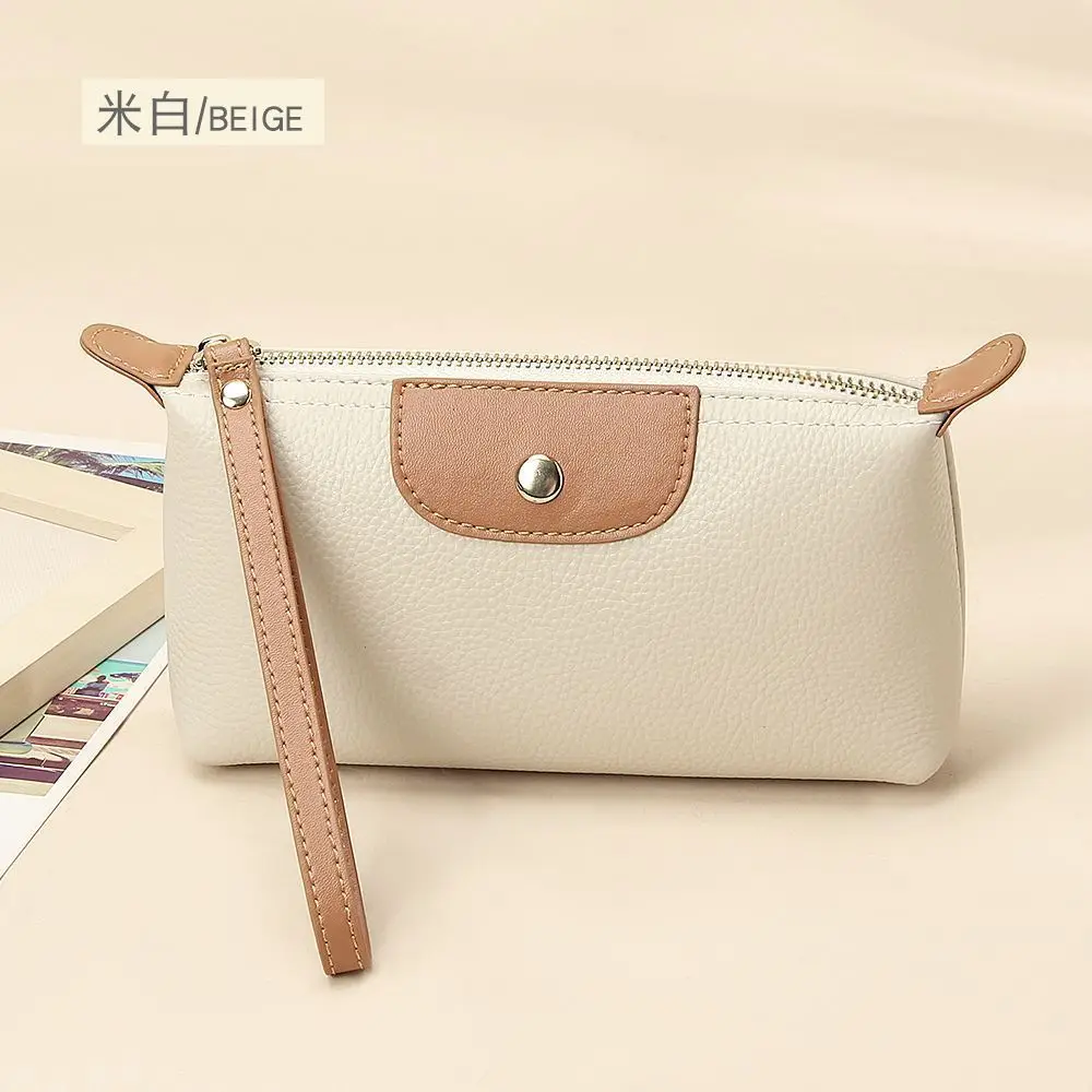 Il nuovo portafoglio da donna alla moda in morbida pelle con colori a contrasto è una borsa da polso portatile, di nicchia e versatile. - immagine 3