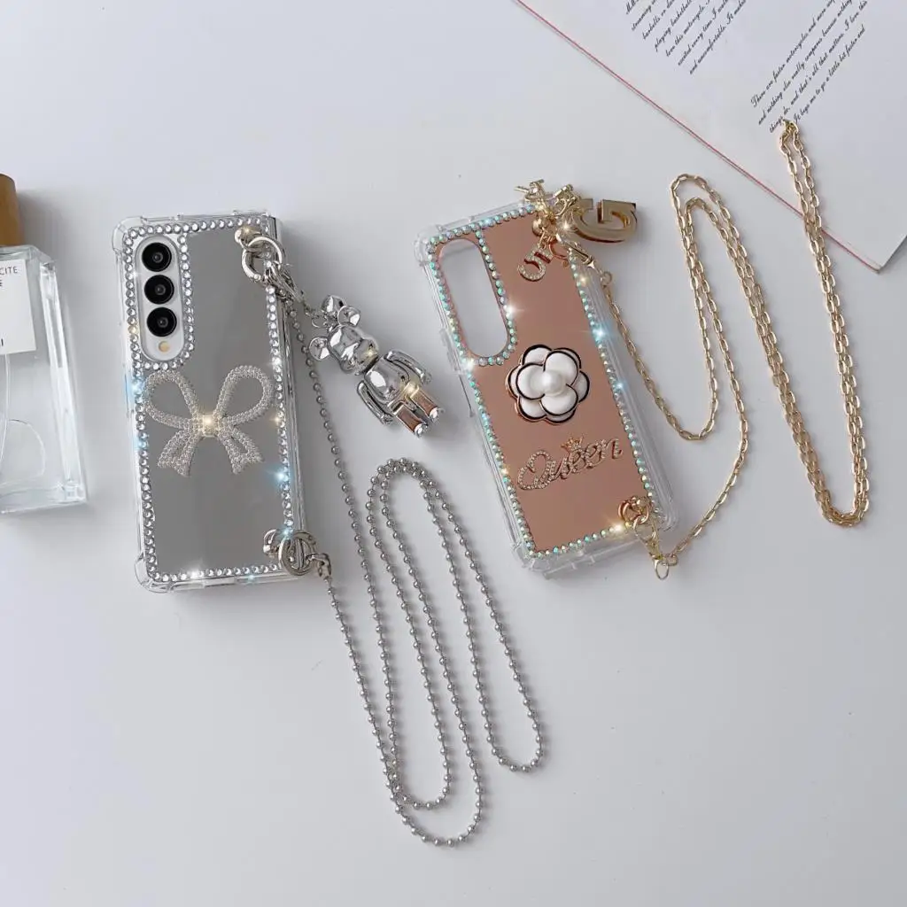 

Luxury Diamond Bowknot Pearl Camellia Phone Case For Samsung Galaxy Z Fold 5 4 3 Rhinestone Mirror Cover With Crossbody Chain