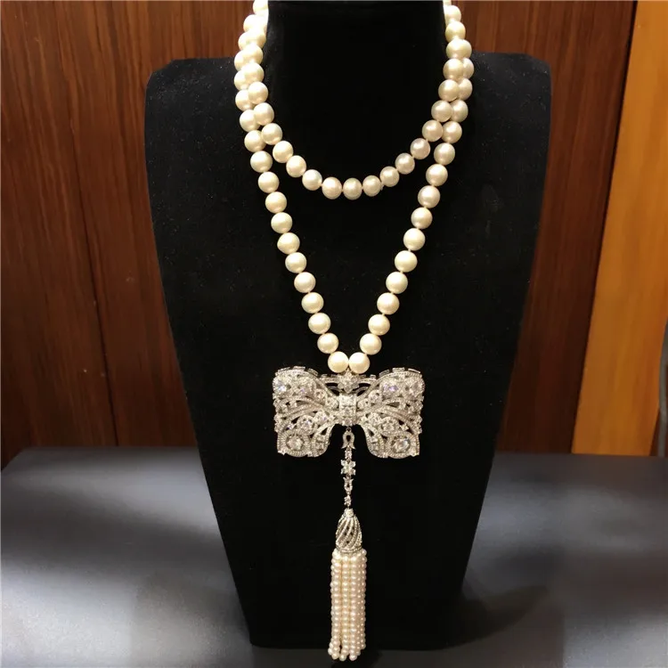 

Hot sell new style 9-10mm white freshwater pearl necklace bowknot zircon accessories long tassel sweater chain fashion jewelry
