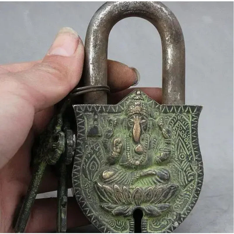 

Ancient Tibetan bronze Buddha, Ganapati Ganesh, Buddha, 2 keys, door lo