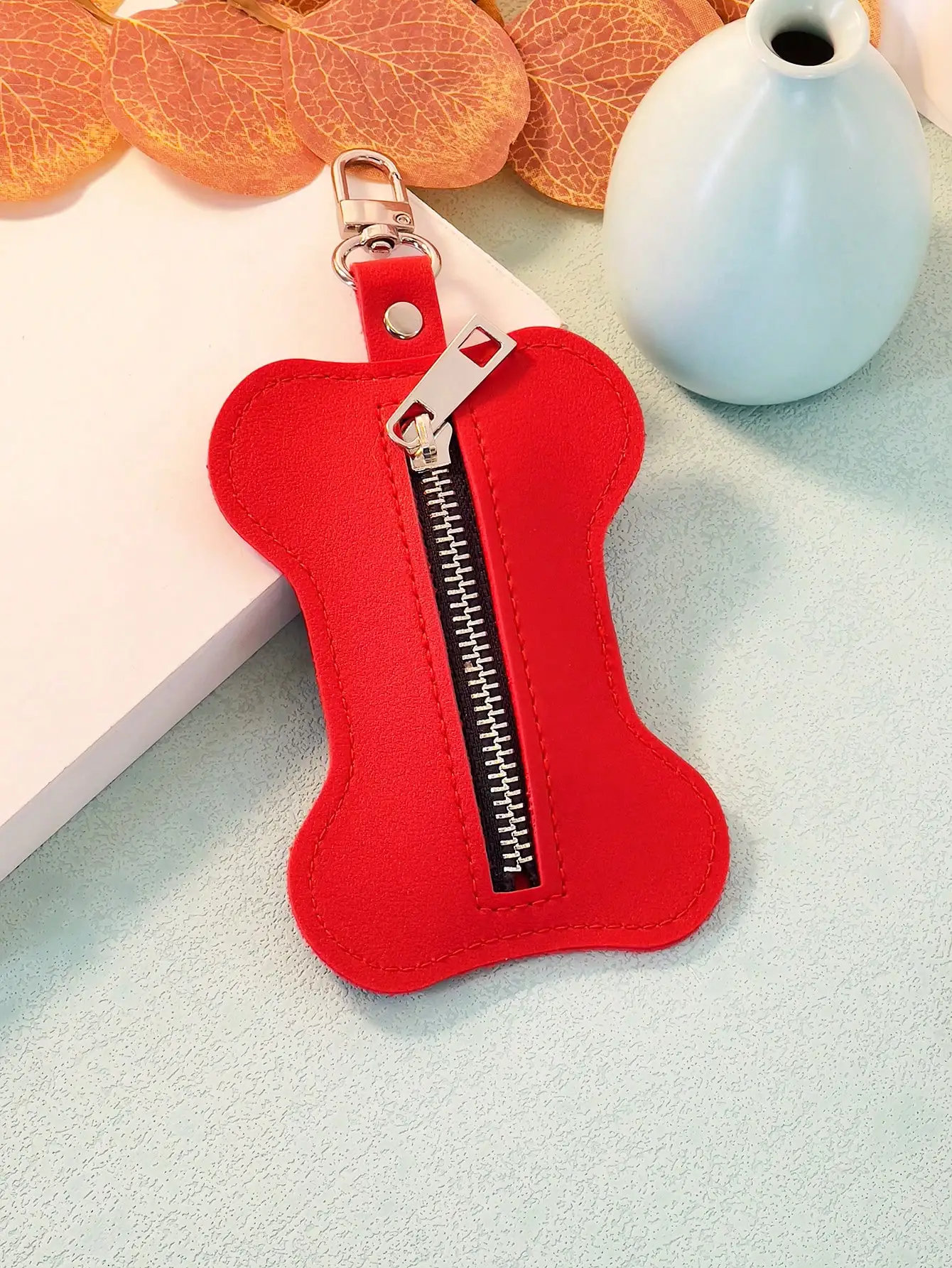 Description Picture 6 of itemA Pu leather pet trash bag collection bag poop bag bone-shaped convenient bag goes out the beautiful fashion hanging bag accesso