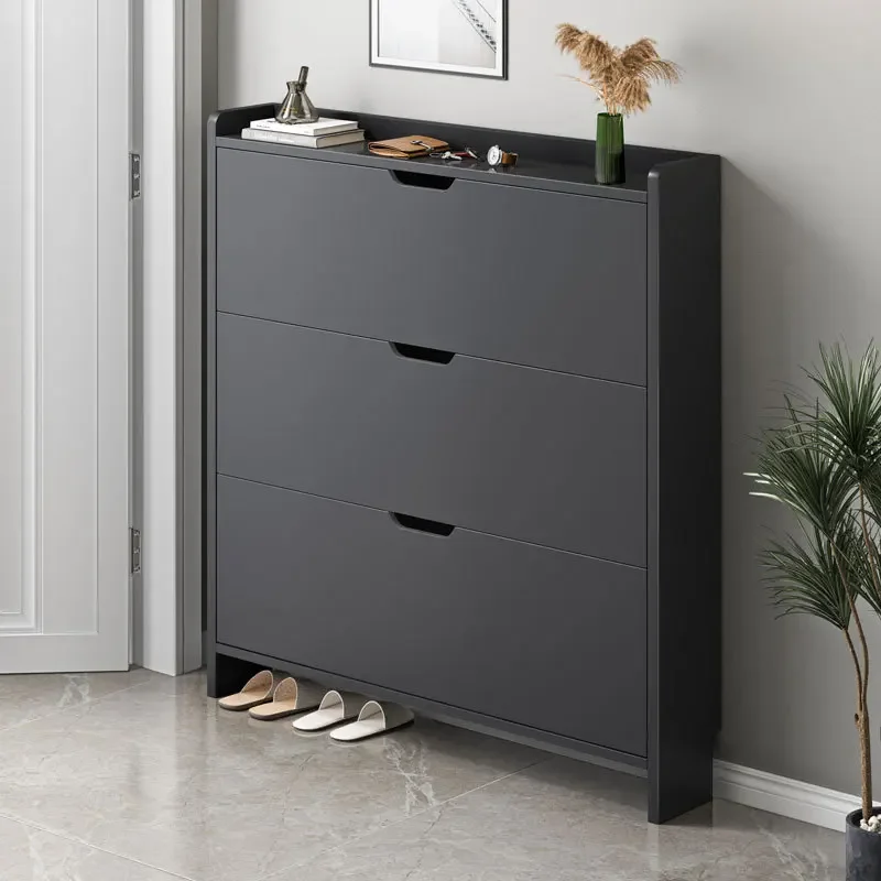 

A simple small household narrow shoe rack with a flip bucket type entrance at the entrance of a household