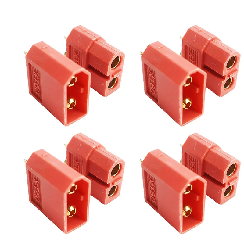 Quatre paires de connecteurs XT60 pour batterie de drone disposées sur fond clair.