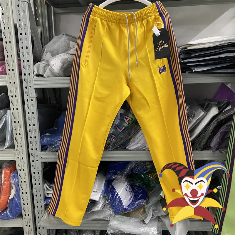 

Yellow Needles Track Pants Men Women Poly Smooth sweatpants Butterfly Logo Knitted Purple Stripe Trousers