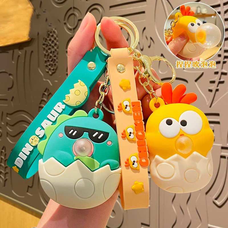 Cartoon Dinosaur Egg Blowing Bubble Animal Play Cool Occhiali Da Sole Dinosaur Key Chain Cute Cross-Eyed Cockerel Doll Portachiavi Coppia